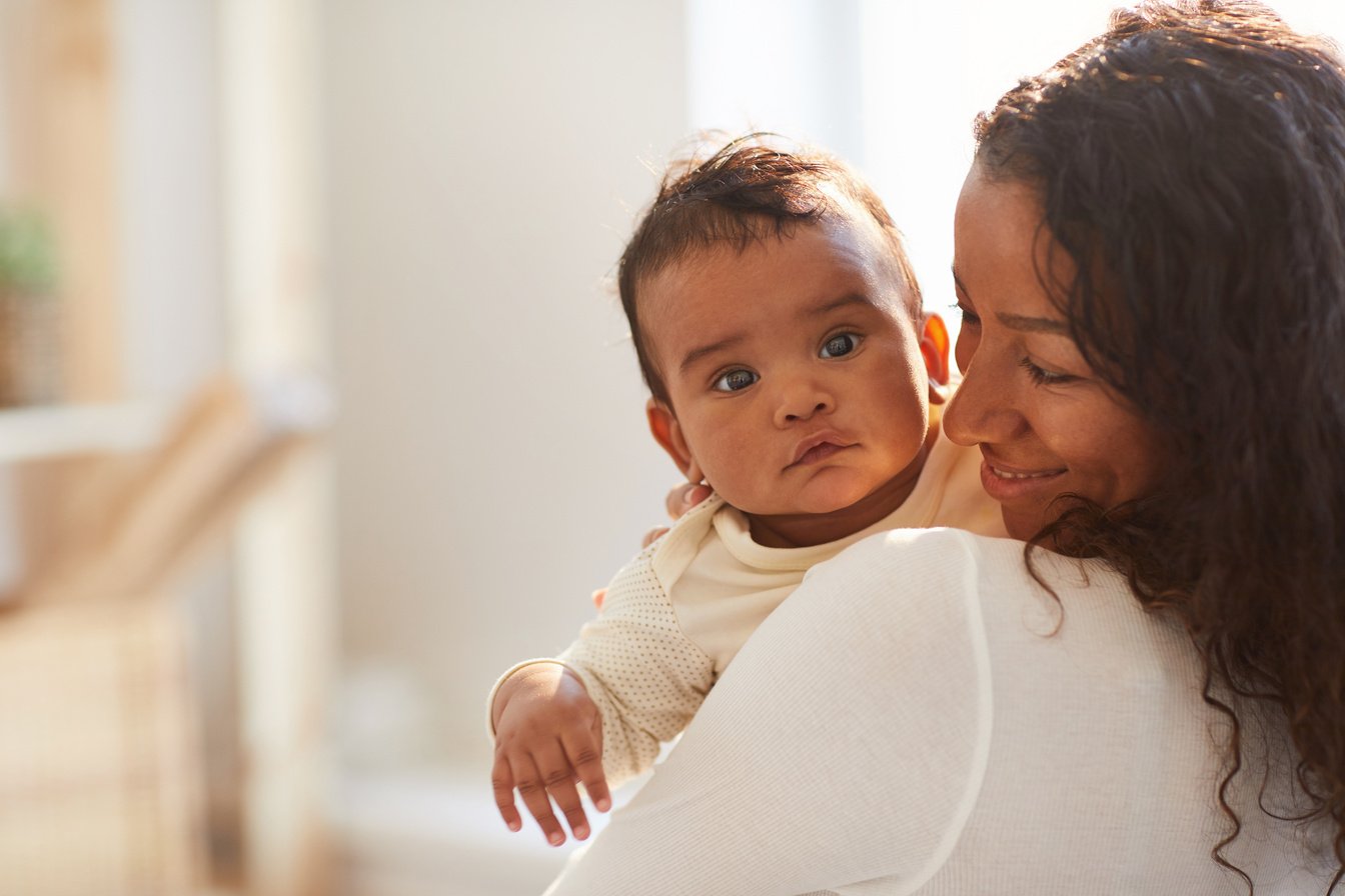 Smiling Mom Holding Baby